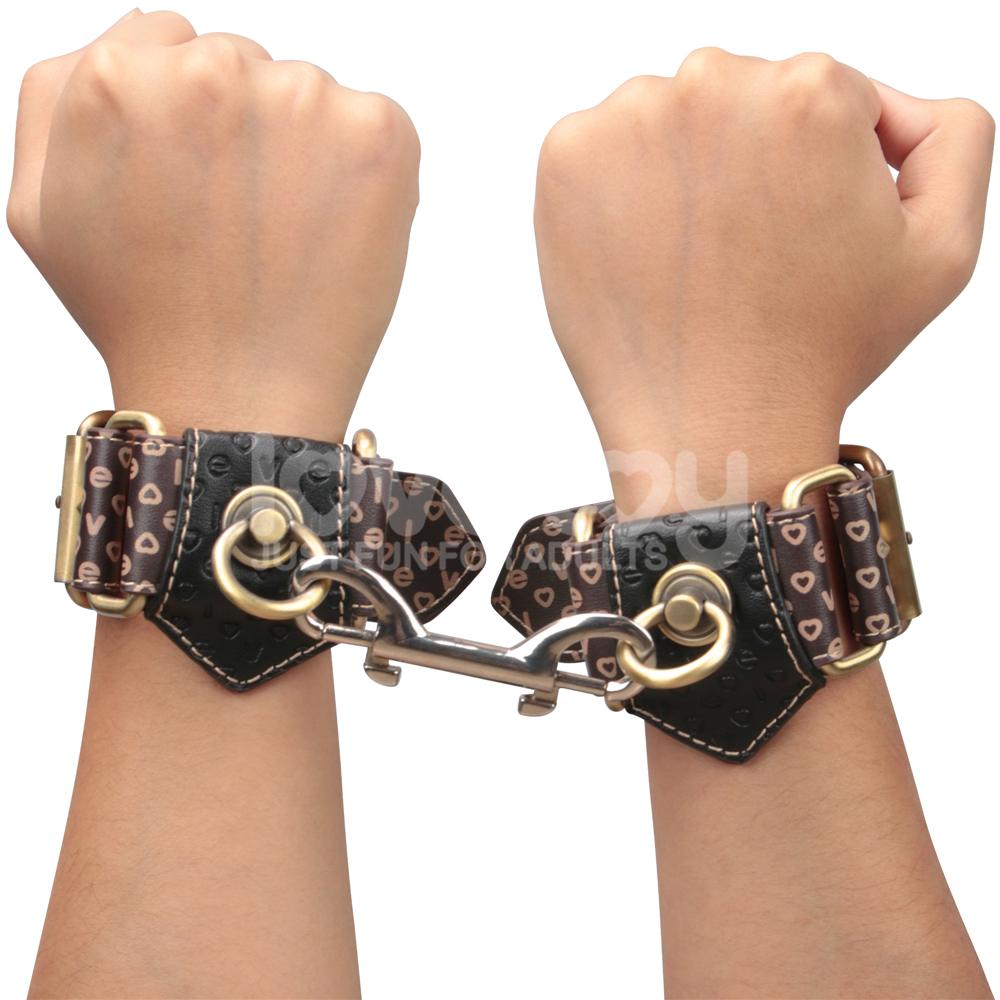 Immerse yourself in a blend of luxury and rustic charm with ... Lovetoy - Rebellion Reign Hand Cuffs - Black photo-3