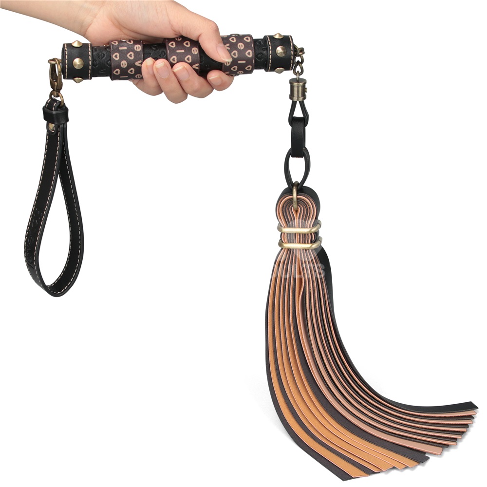 Immerse yourself in a blend of luxury and rustic charm with ... Lovetoy - Rebellion Reign Flogger - Black/Beige photo-2