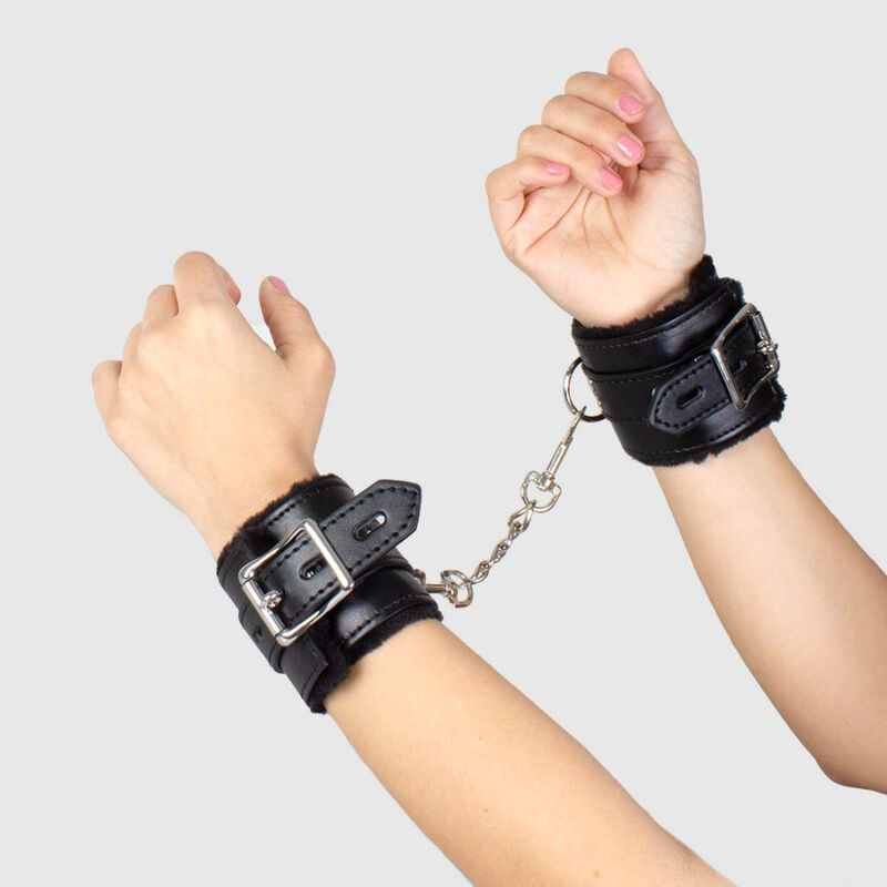 These lightly padded cuffs combine faux leather with silver ... Secret Play - Bondage Handcuffs - Black photo-2