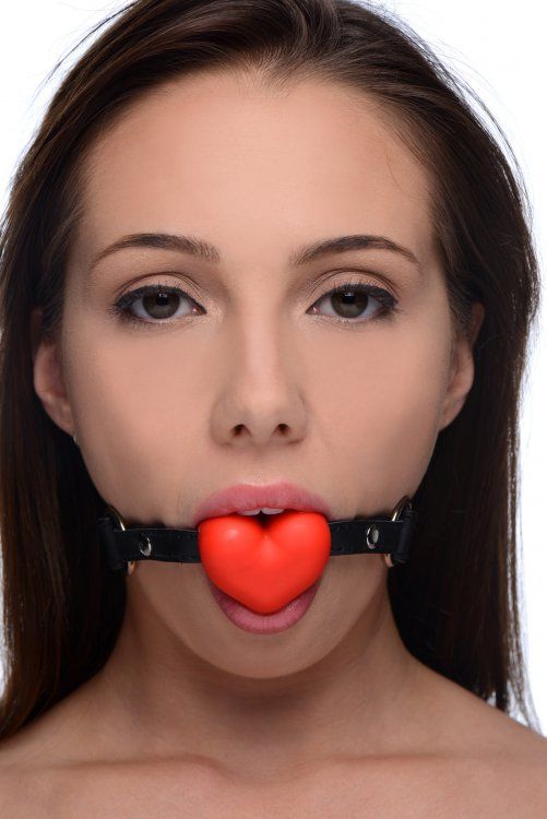 Keep your lover quiet with a sexy heart-shaped gag that allo... Frisky - Heart Beat Silicone Mouth Gag - Red photo-2