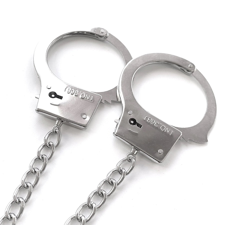 Anal play and bondage all in one! Metal cuffs chained to a d... Nixie - Metal Plug w Cuffs - Silver photo-3
