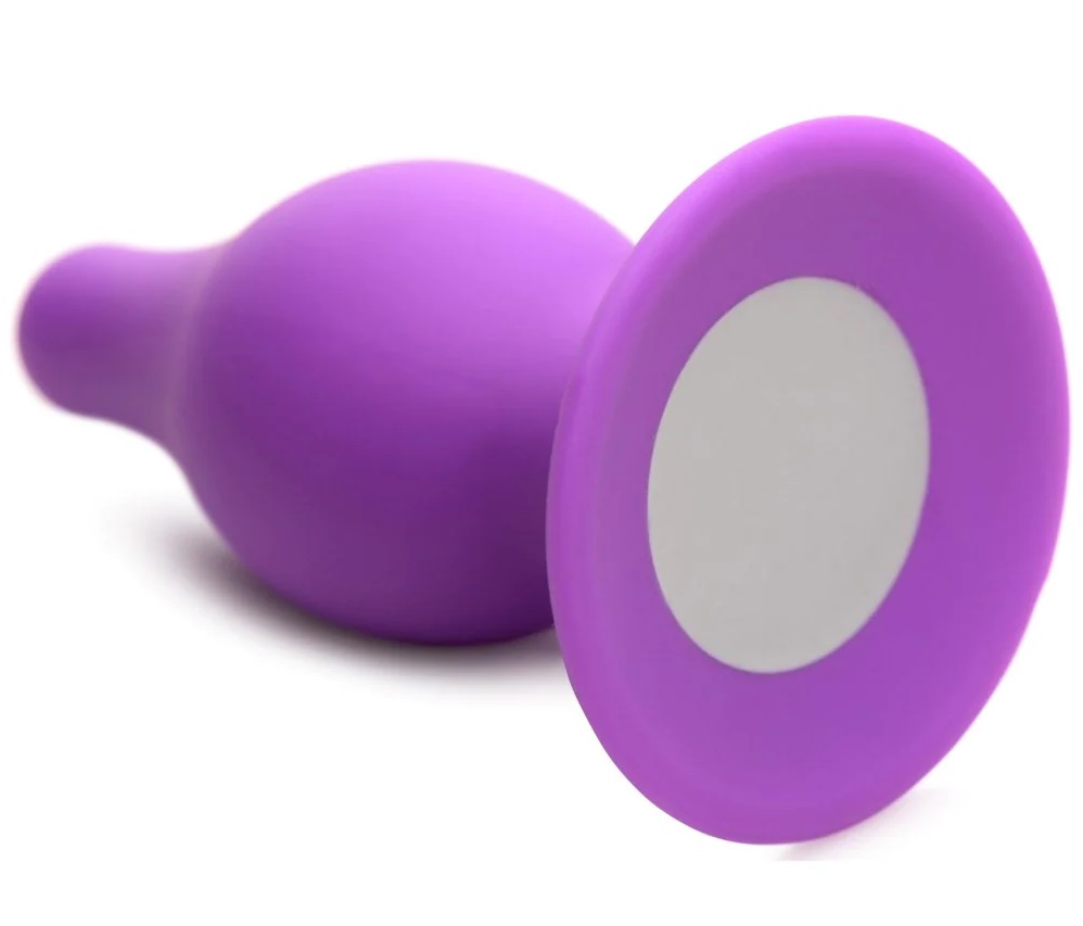 Satisfy your backdoor cravings with this plush, squeezable, ... Squeeze-It - Tapered Anal Plug M - Purple photo-3